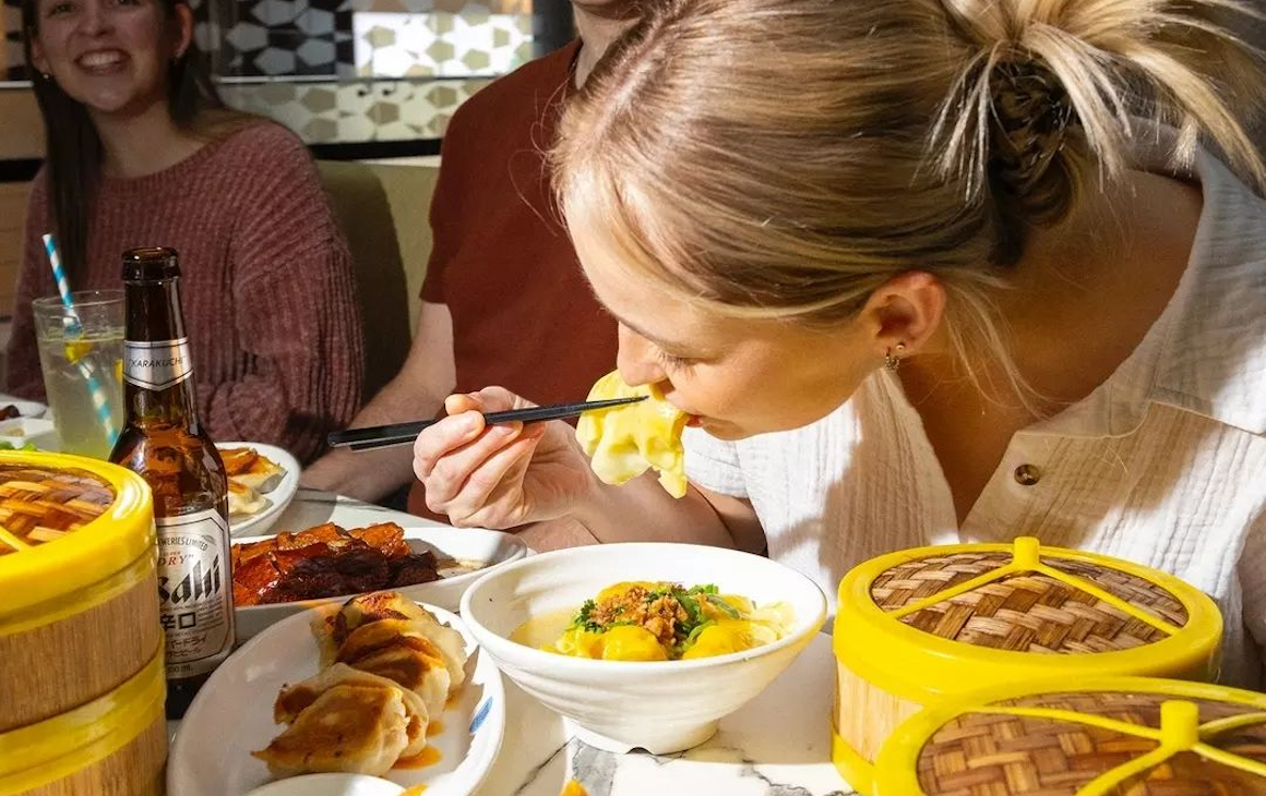 Someone eating dumplings in Perth